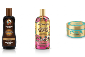 Top tanning bed lotions, including Australian Gold Dark Tanning Accelerator, Ed Hardy Coconut Kisses, and Devoted Creations #TANLIFE, displayed in professional studio product photography.