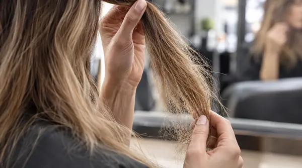 Close view of damaged hair cuticles with raised scales