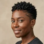 Close-up of a Black woman with fine natural hair and a short tapered haircuts