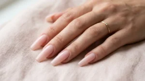 Close-up of ballerina-shaped nails with tapered sides and flat tips