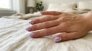 Lilac manicure with delicate floral accent nail designs