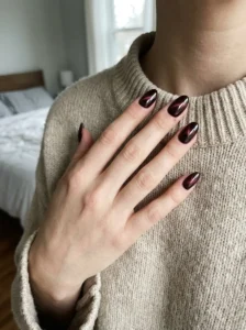 Black cherry cat eye nails with a subtle magnetic glow