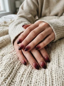 Black cherry ombré nails with a deep burgundy gradient