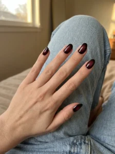 Black cherry aura nails with a soft wine-red center
