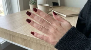 Classic glossy burgundy manicure on neatly shaped nails