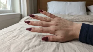Short matte burgundy nails with a deep red-wine finish