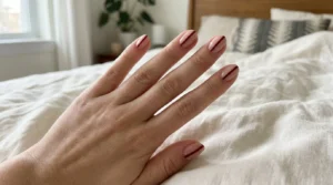 Sheer nude nails with minimal burgundy side French tips